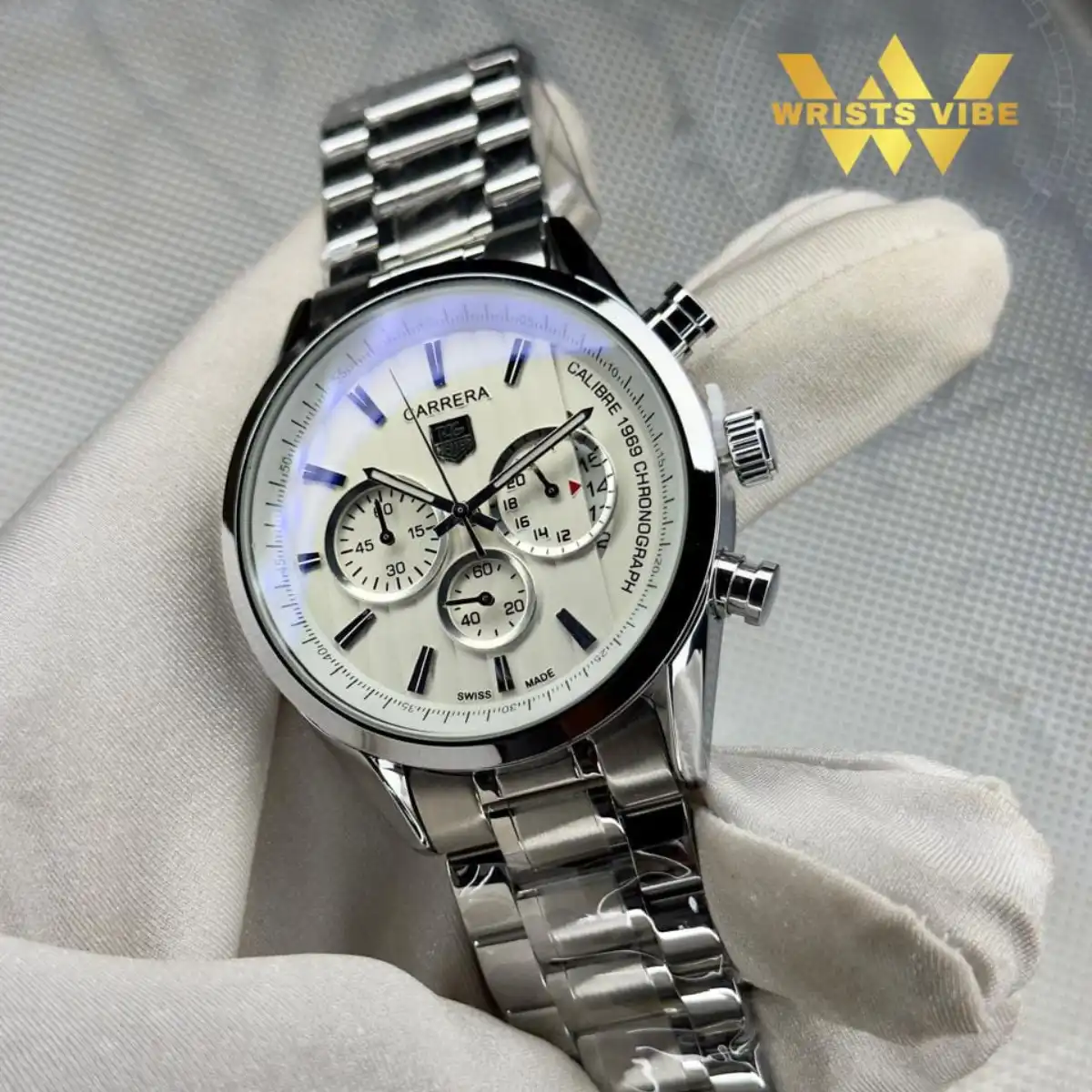 Close up of the Carrera Premium Chronograph Watch paired with a sharp formal suit