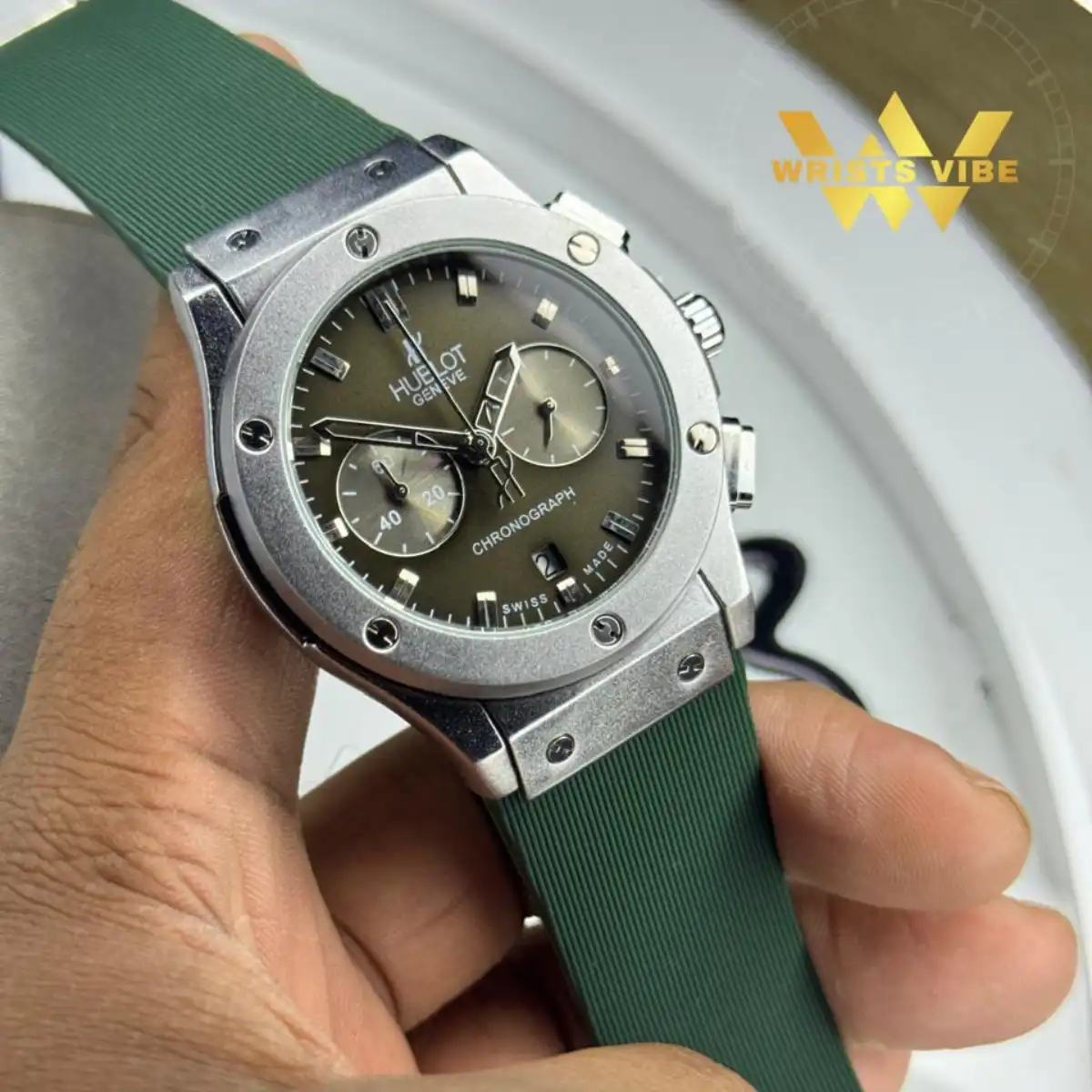 Stylish man wearing the Hublot Chronograph Premium Watch with a casual weekend t-shirt