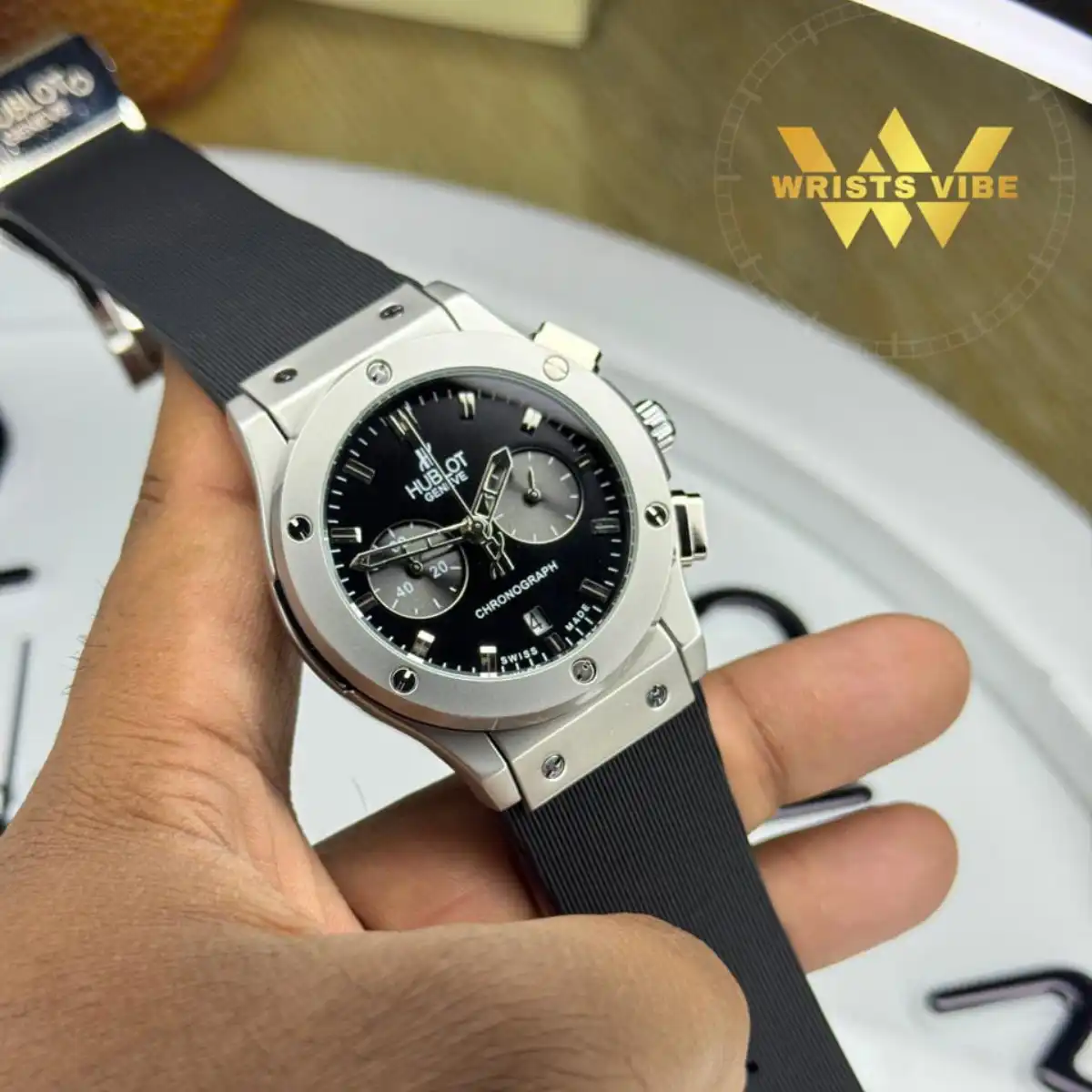 Confident man wearing the Hublot Chronograph Premium Watch with a formal suit