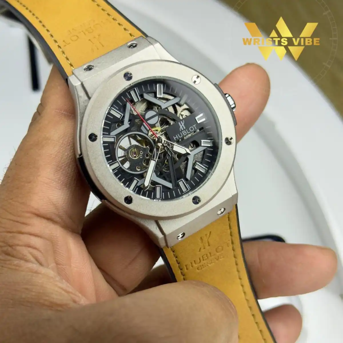 Stylish man wearing the Hublot Skeleton Edition Watch with a sharp office blazer